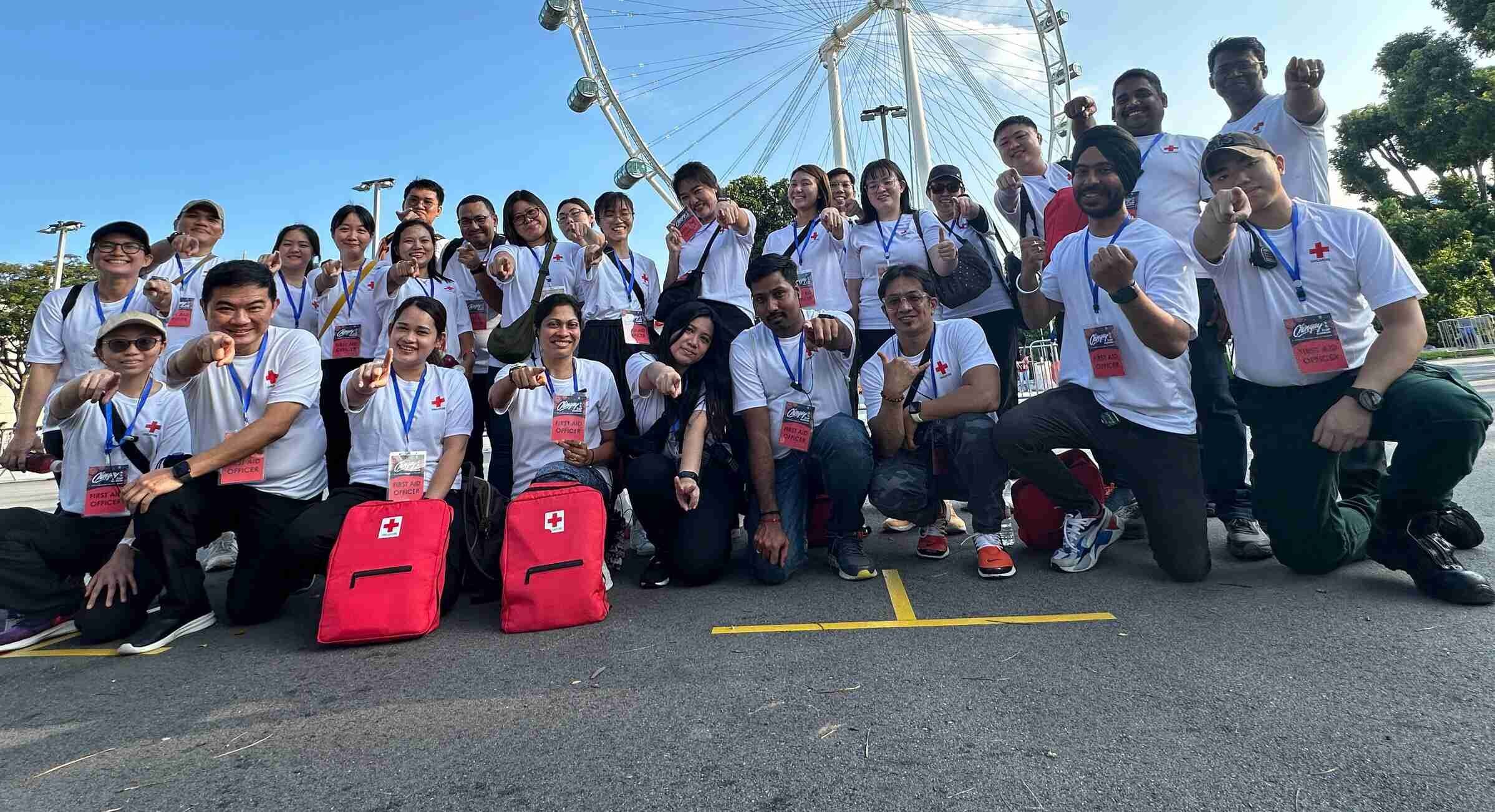 Community First Aiders in front of the Singapore Flyer