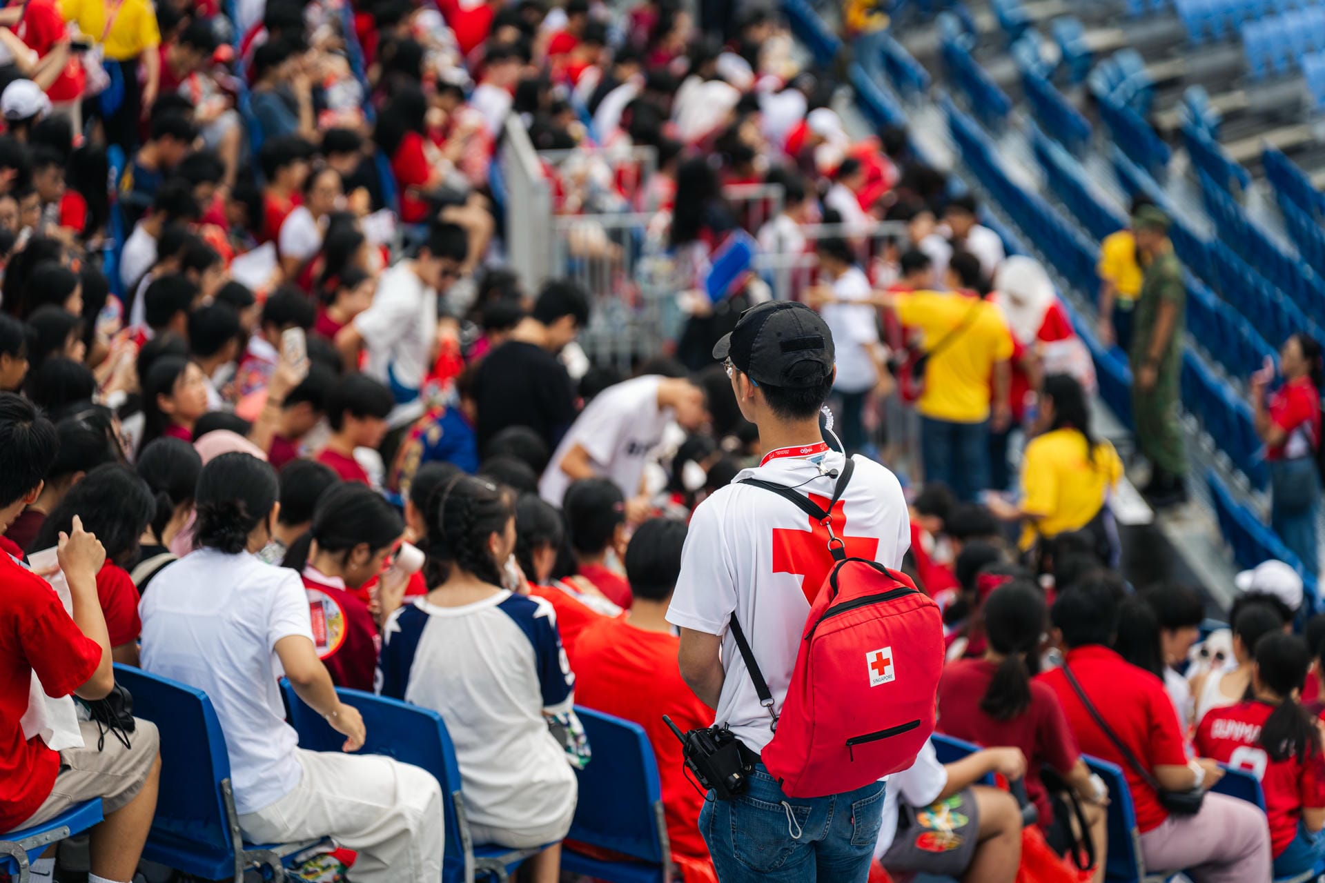 Singapore Red Cross volunteer keeping an eye on the NDP crowd