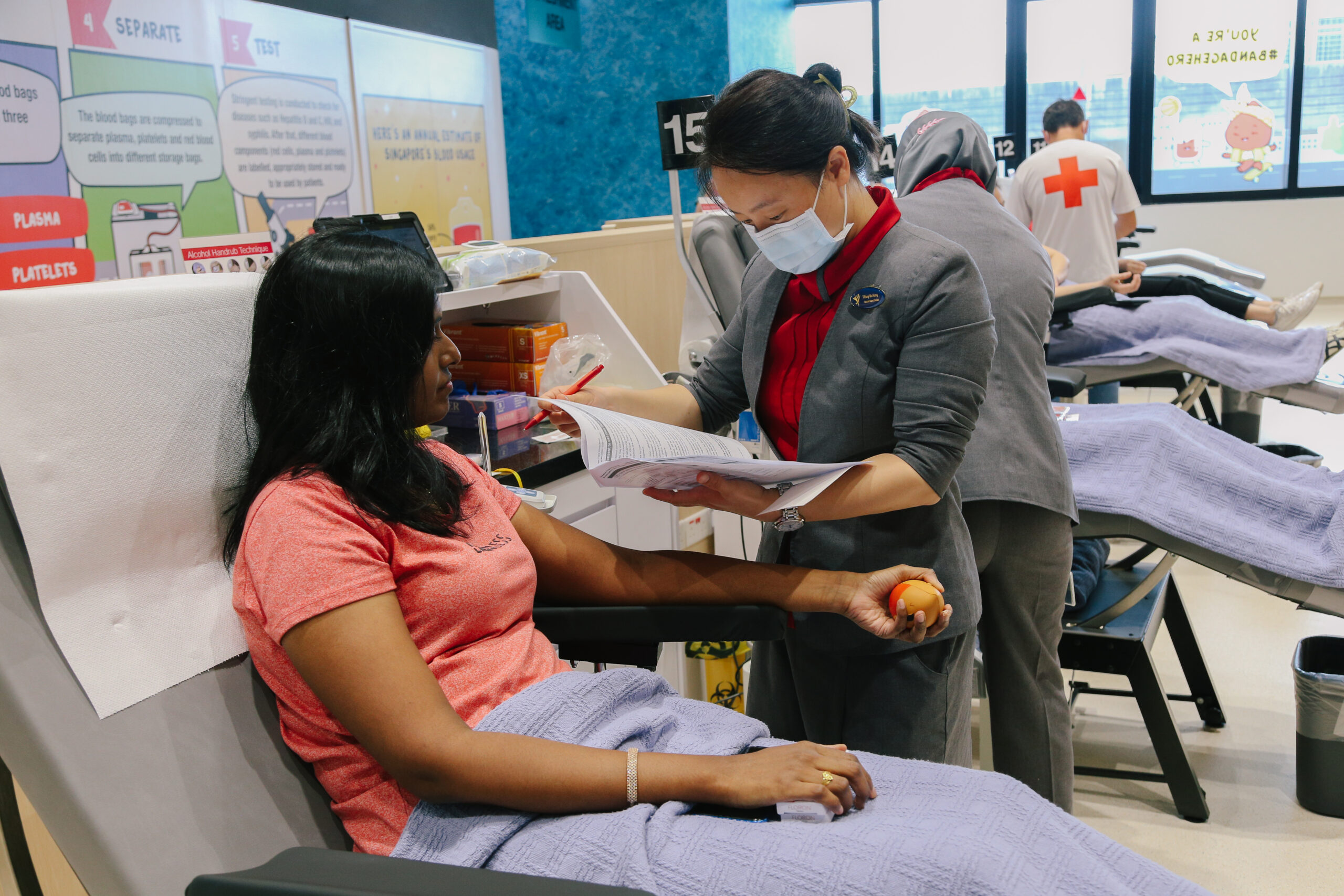 Blood donor donating blood at a Singapore Red Cross blood donation site