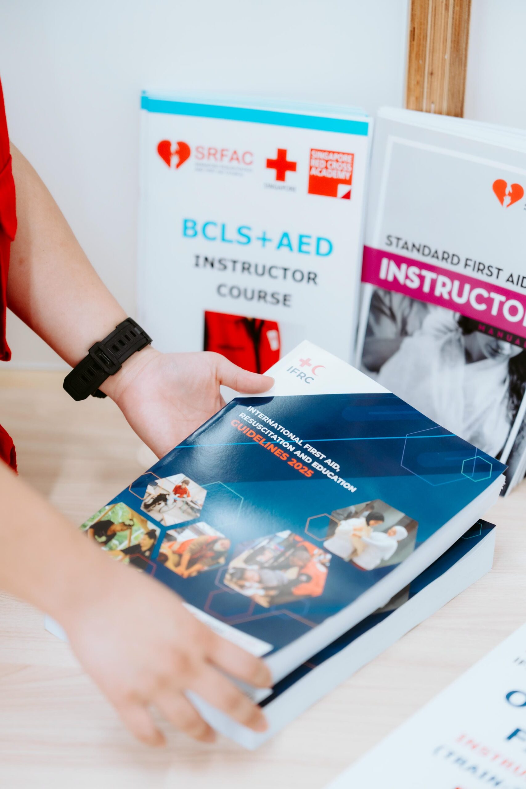 Trainee-Instructor conducting a mock teaching demonstration during the BCLS+AED Instructor Course at Singapore Red Cross Academy