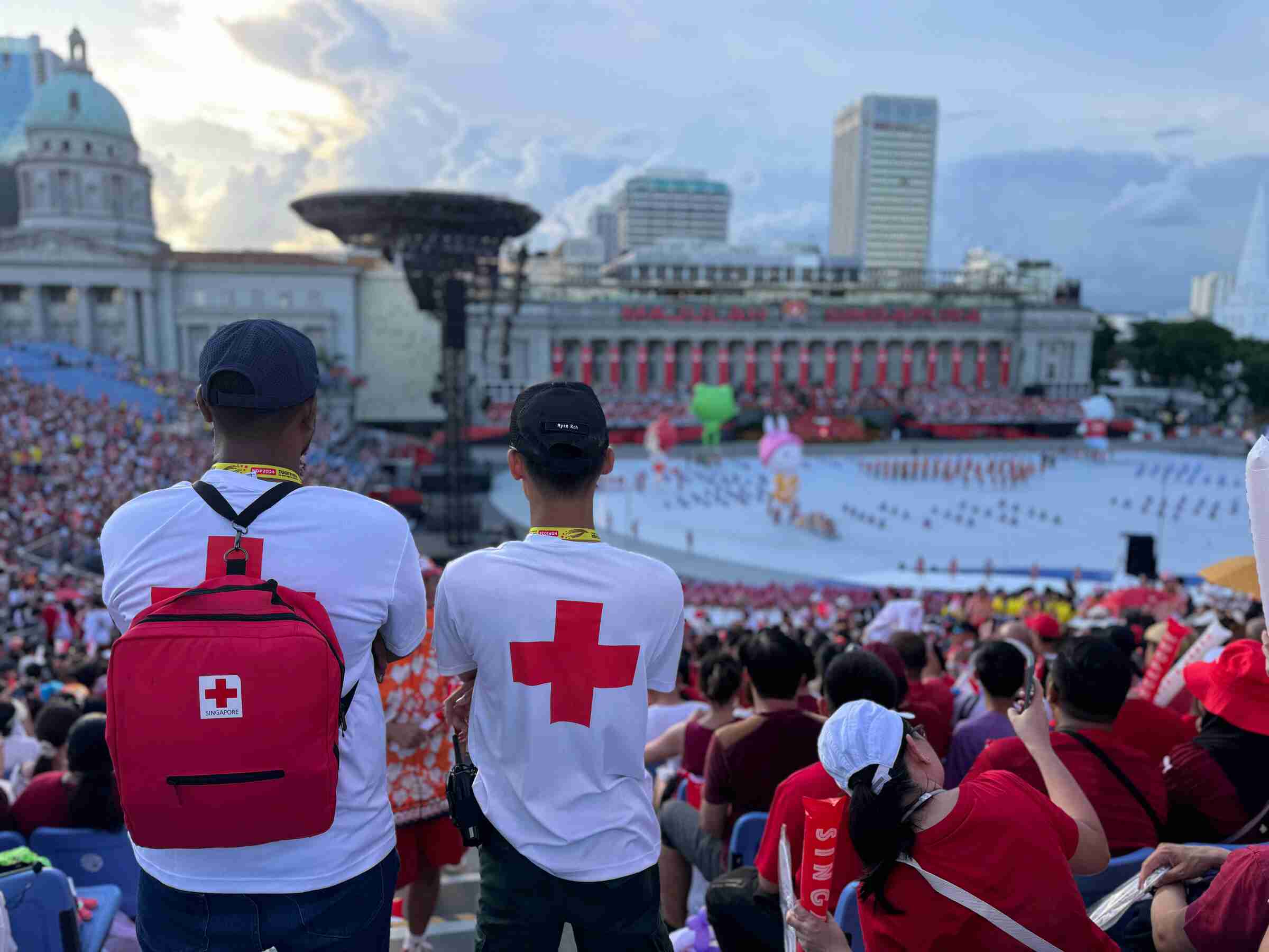 Two community First Aiders overlooking the NDP 2024