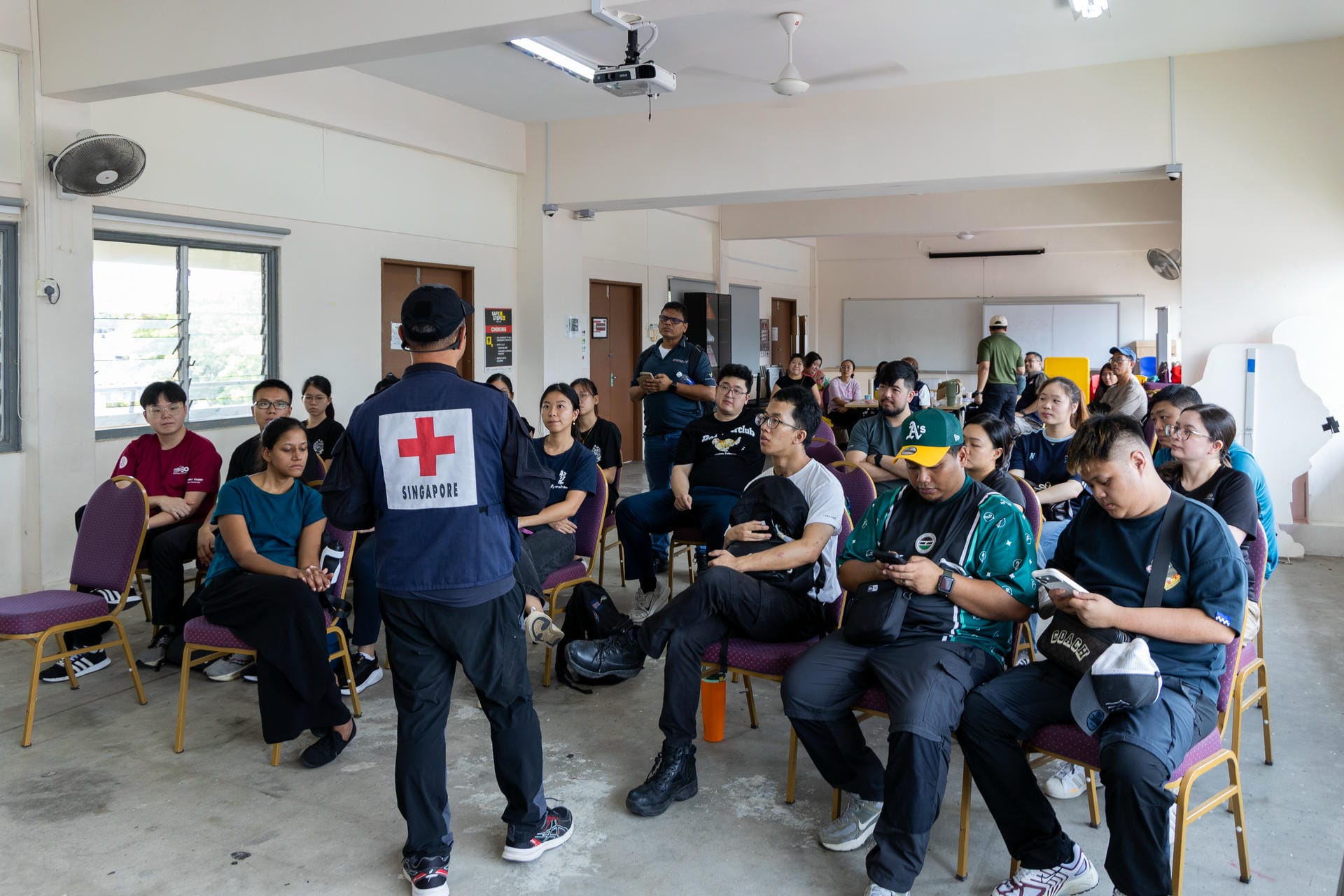 Learners taking part in a field simulation exercise during the Overseas Disaster Deployment Training at Singapore Red Cross Academy