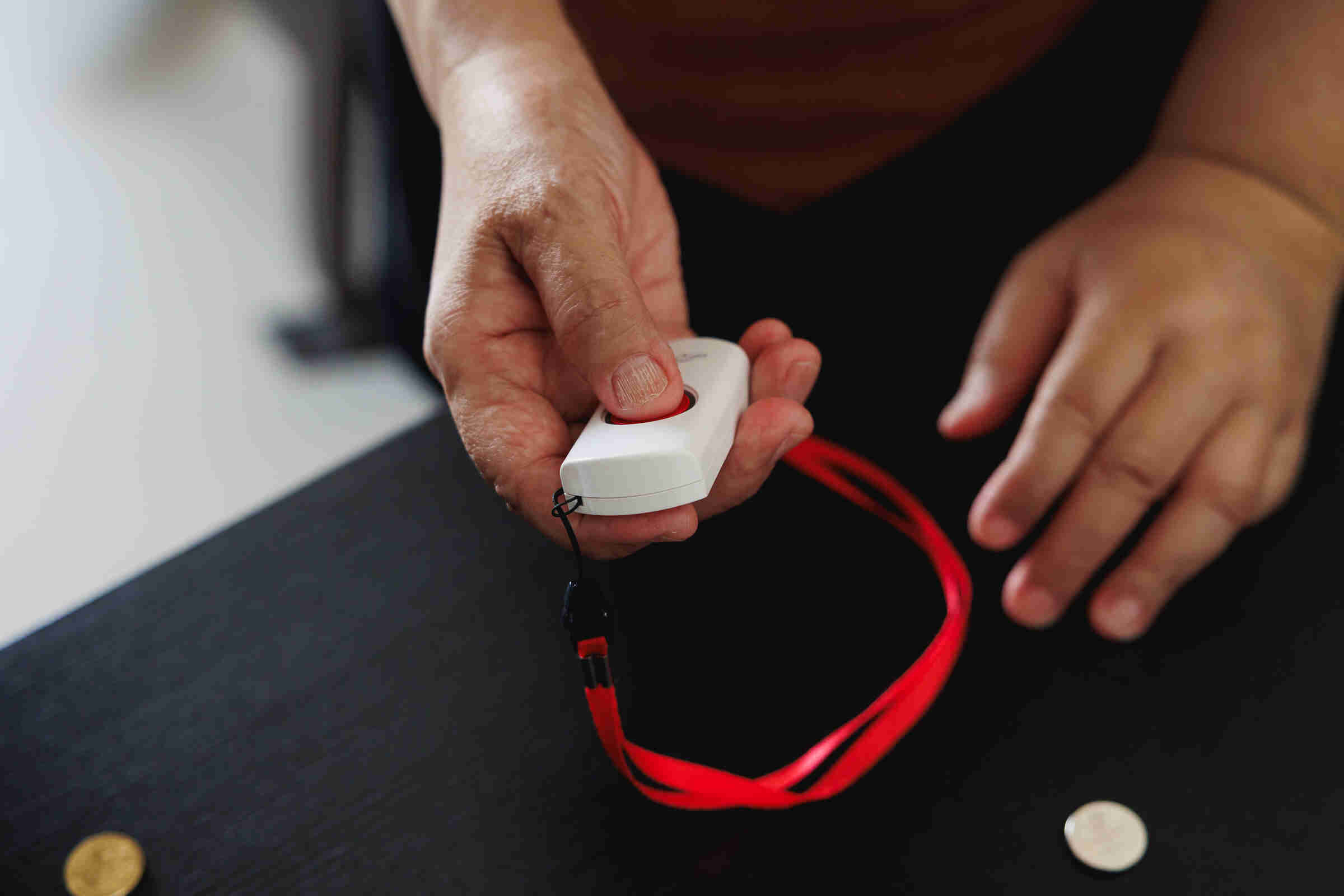Senior pushing HoME+ panic button