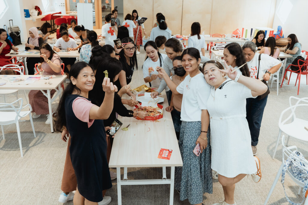 Migrant domestic workers participating in an outreach program