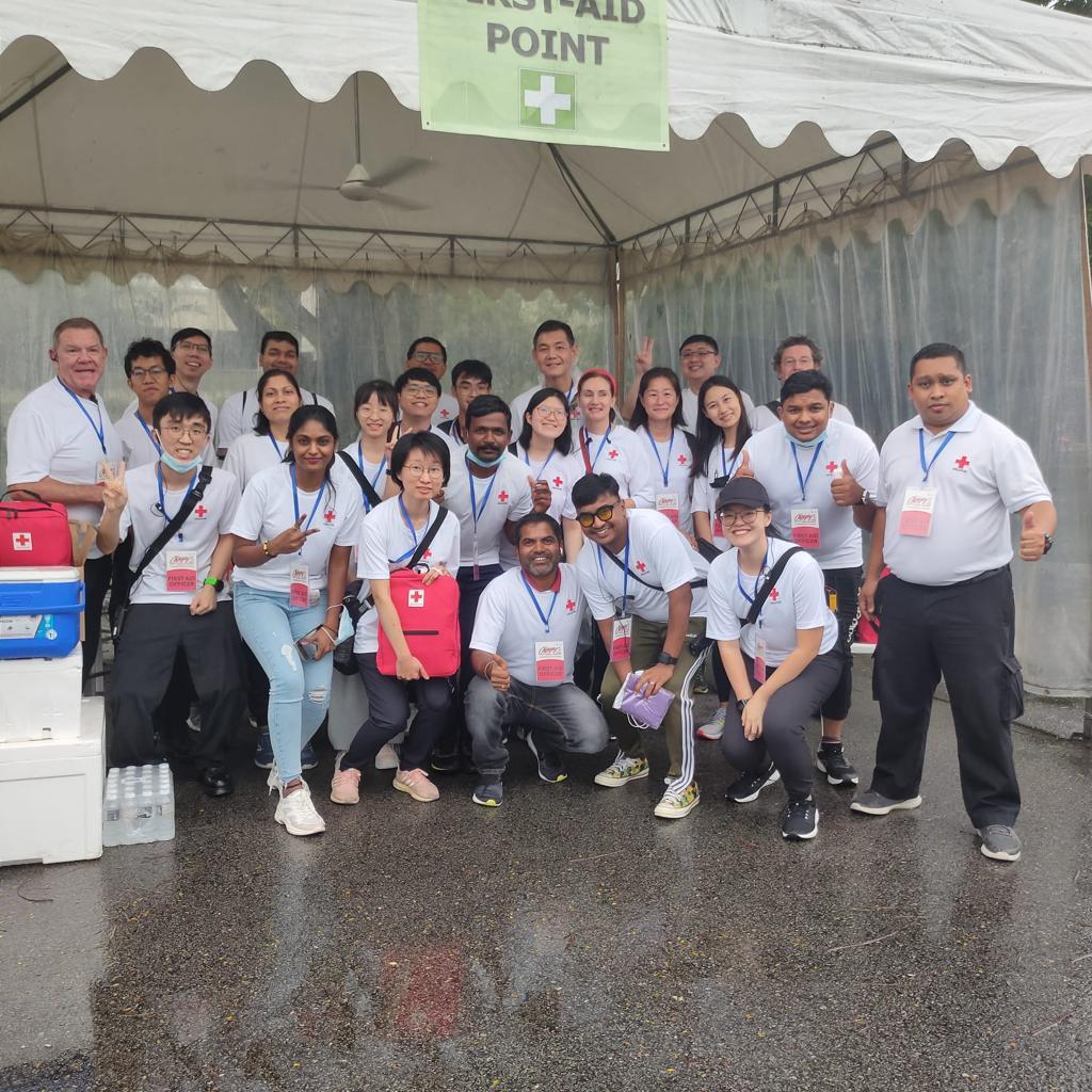 Community First Aiders taking a group photo at first aid point at the Chingay Parade