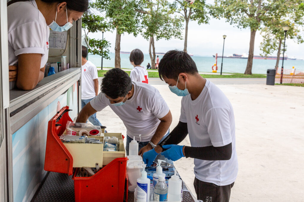 First aid volunteers preparing equipment at the beach