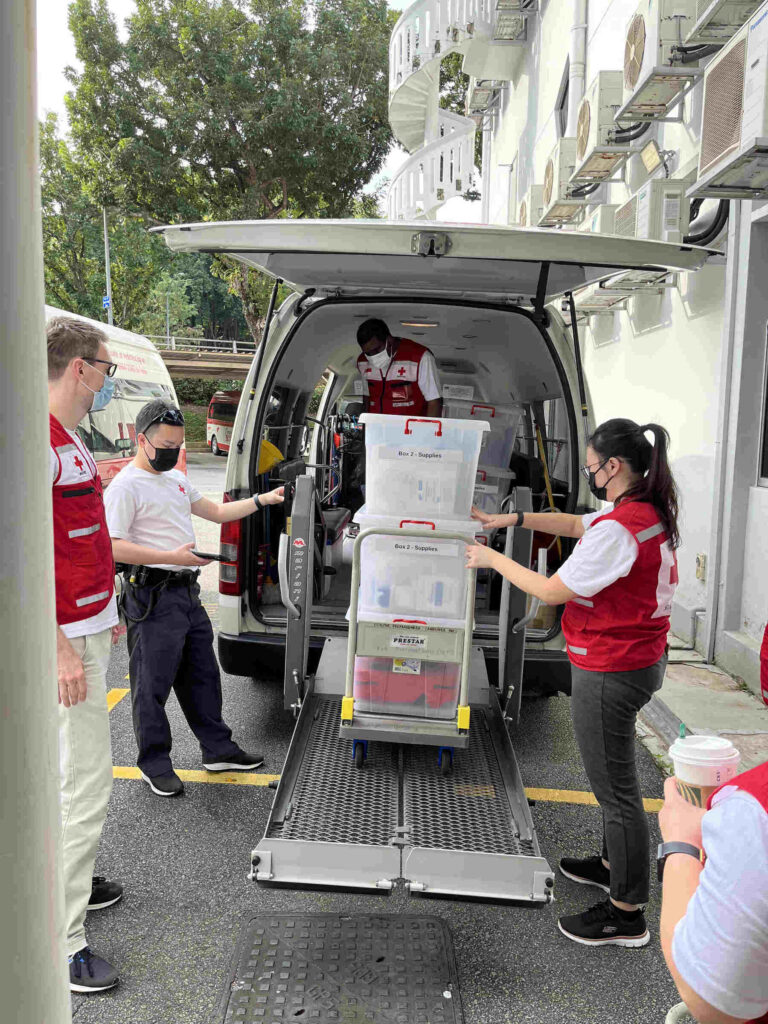 Singapore Red Cross volunteer overlooking the audience at Singapore’s NDP 2025